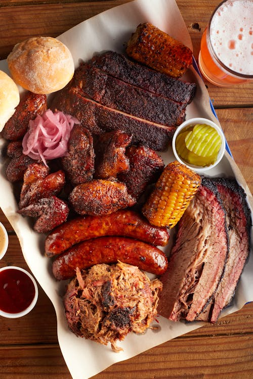 A barbecue platter with smoked meats and sausages